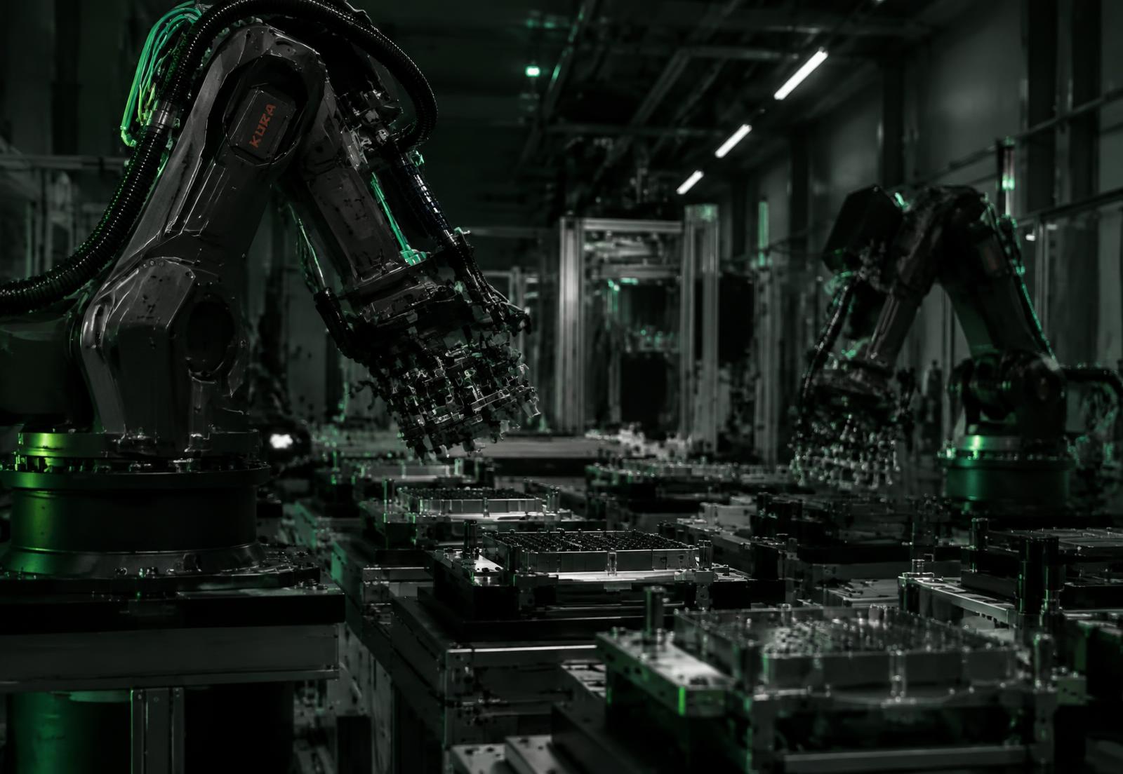Robotic arms working in a precision automated factory