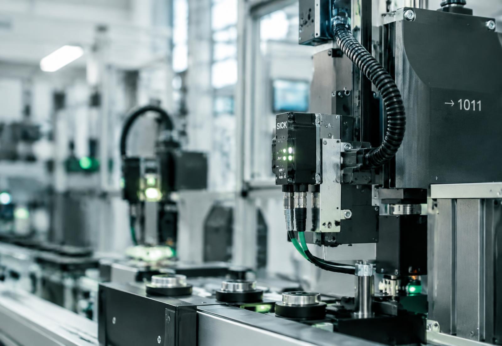 Industrial IoT sensors mounted on automated production machinery